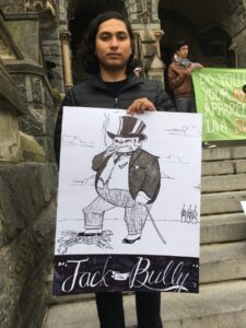 Obed Ventura protests outside Healy. Photo: Lilah Burke
