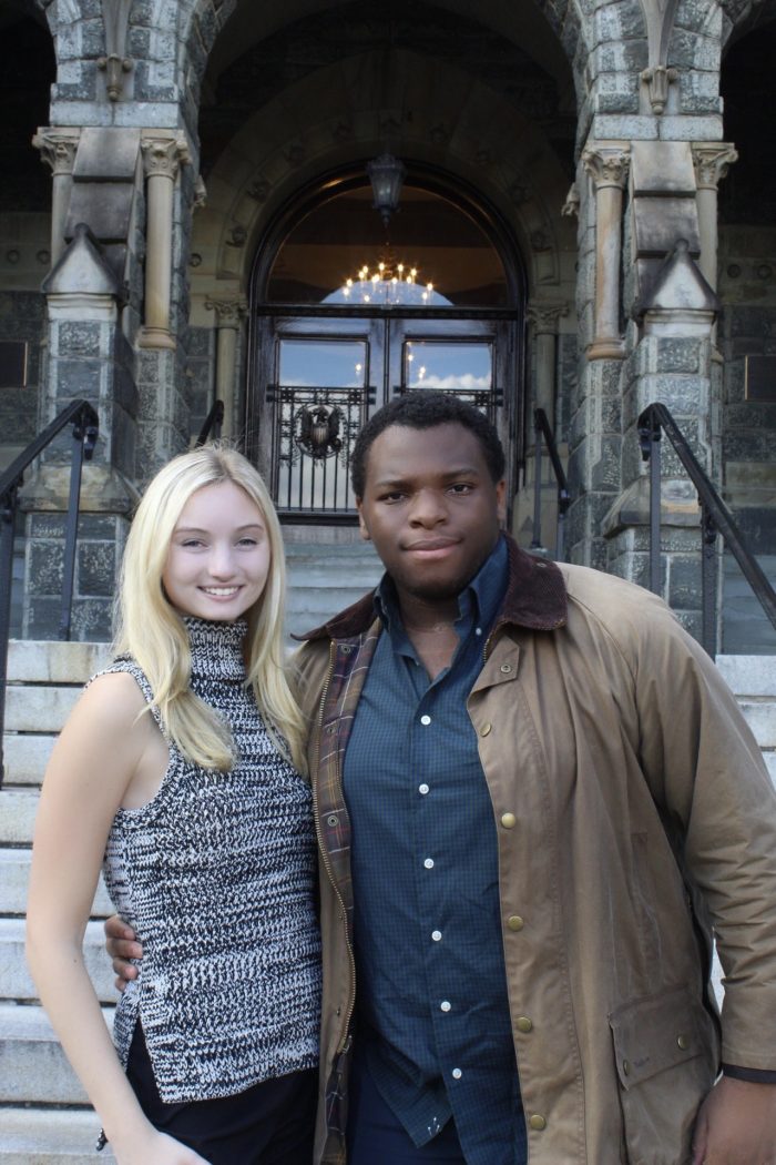 Chijioke Achebe and Devon Pasieka pose before Healy Hall.