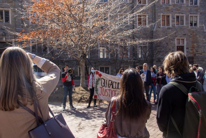 FSJP organizer speaking into a megaphone.