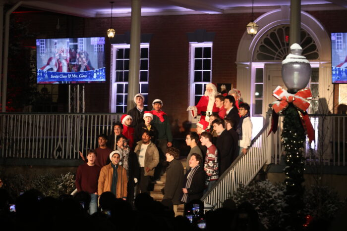The Georgetown Chimes sing in the Quad, with Santa and Mrs. Claus.