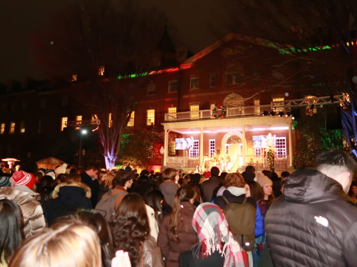 Viewers listen to one of the music groups as they regale audiences with Christmas carols.