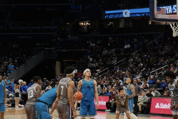 Georgetown’s Caleb Williams stands at the free throw line, ball in hand, wearing a tidal blue jersey with the number four on the front