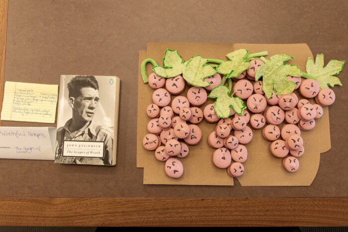 Macarons shaped like grape vines, next to the book inspiration.